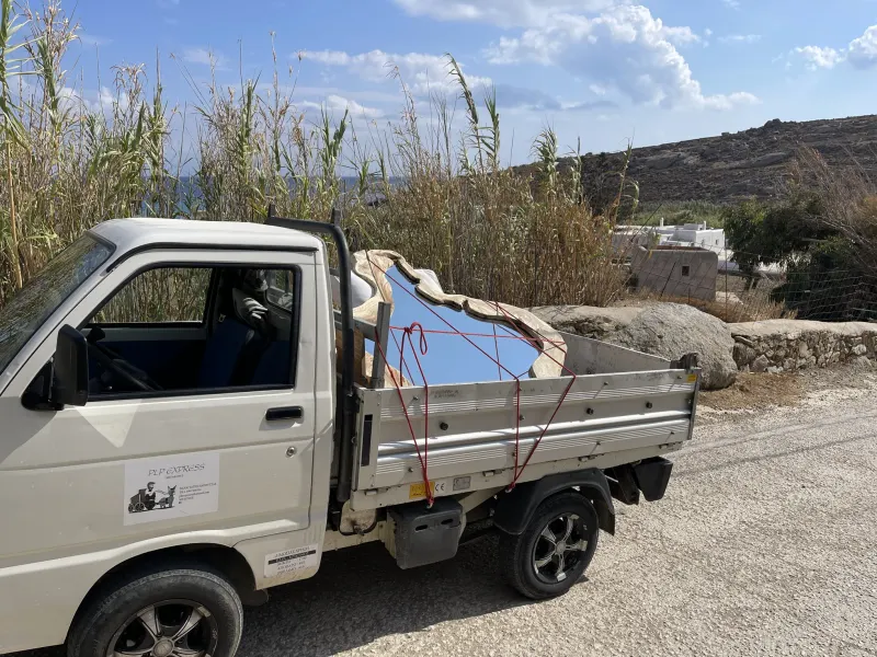 Truck carrying materials past the dunes
