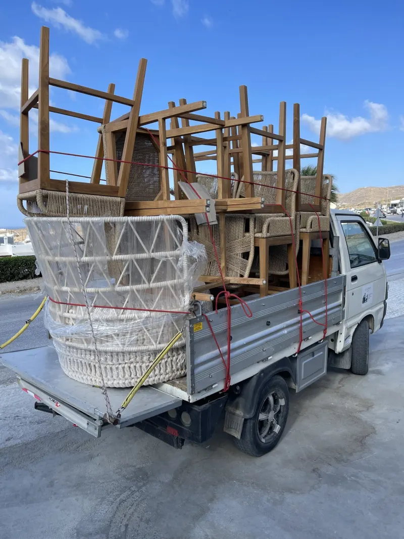 Stacked chairs being transported