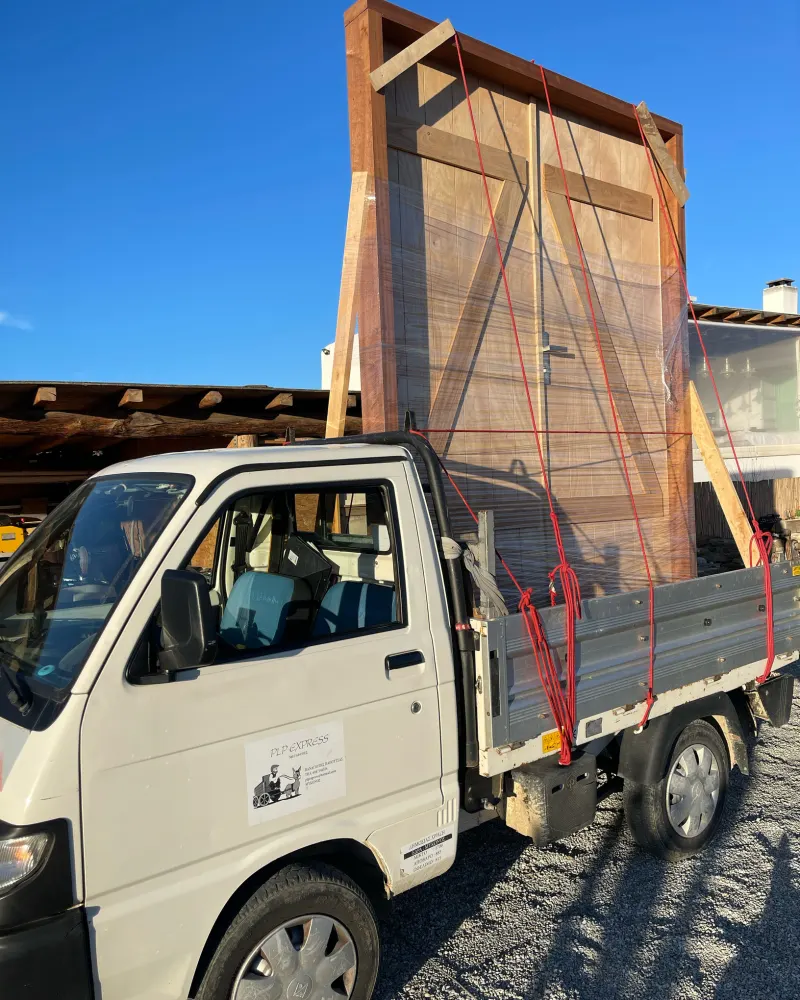 Tall wooden crate being delivered